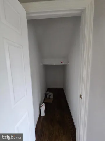 a view of staircase with white walls