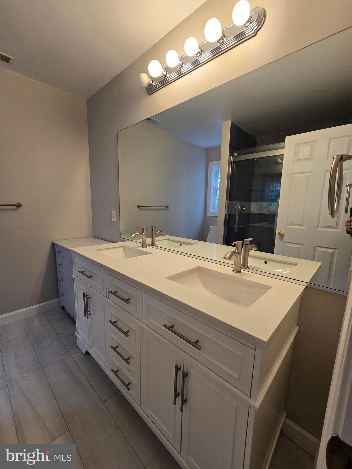 32155 River Road Millington, MD 21651 - Photo 31 of 54 a bathroom with a double vanity sink and a mirror