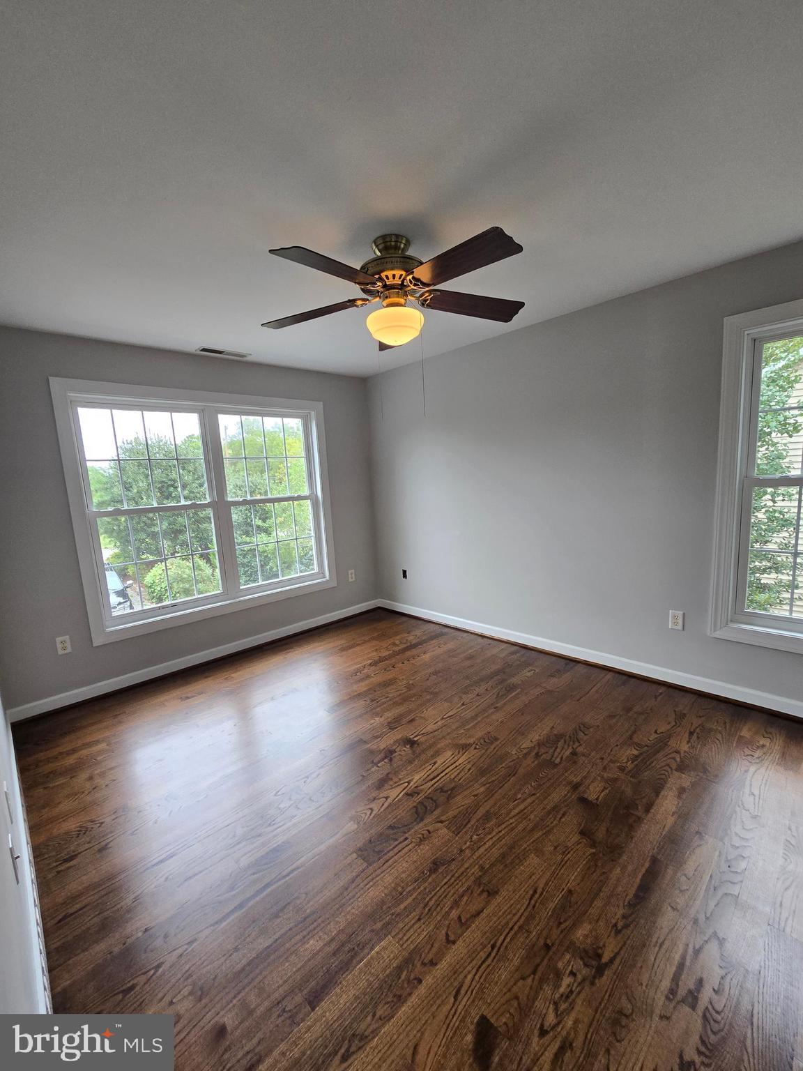32155 River Road Millington, MD 21651 - Photo 33 of 54 an empty room with wooden floor and windows