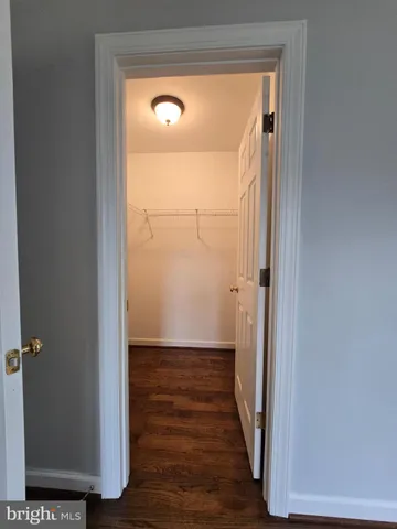 a bathroom with a sink a toilet a mirror and vanity