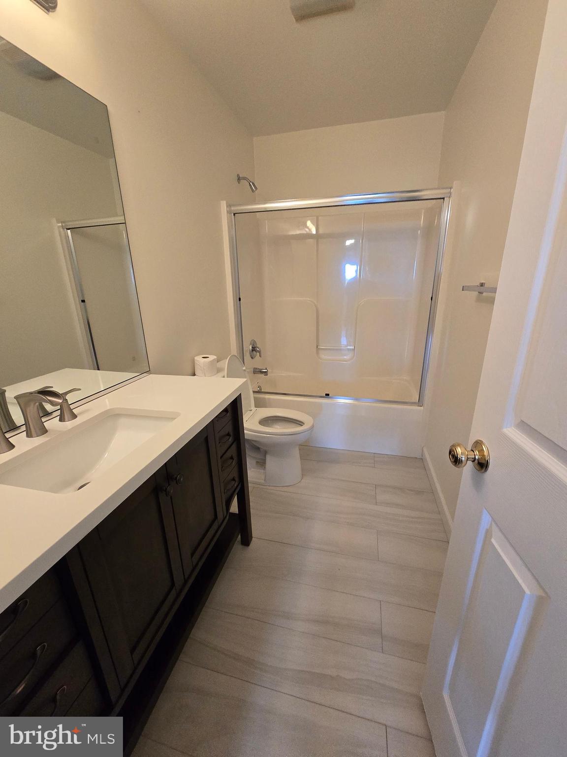 32155 River Road Millington, MD 21651 - Photo 42 of 54 a bathroom with a double vanity sink a toilet and a mirror