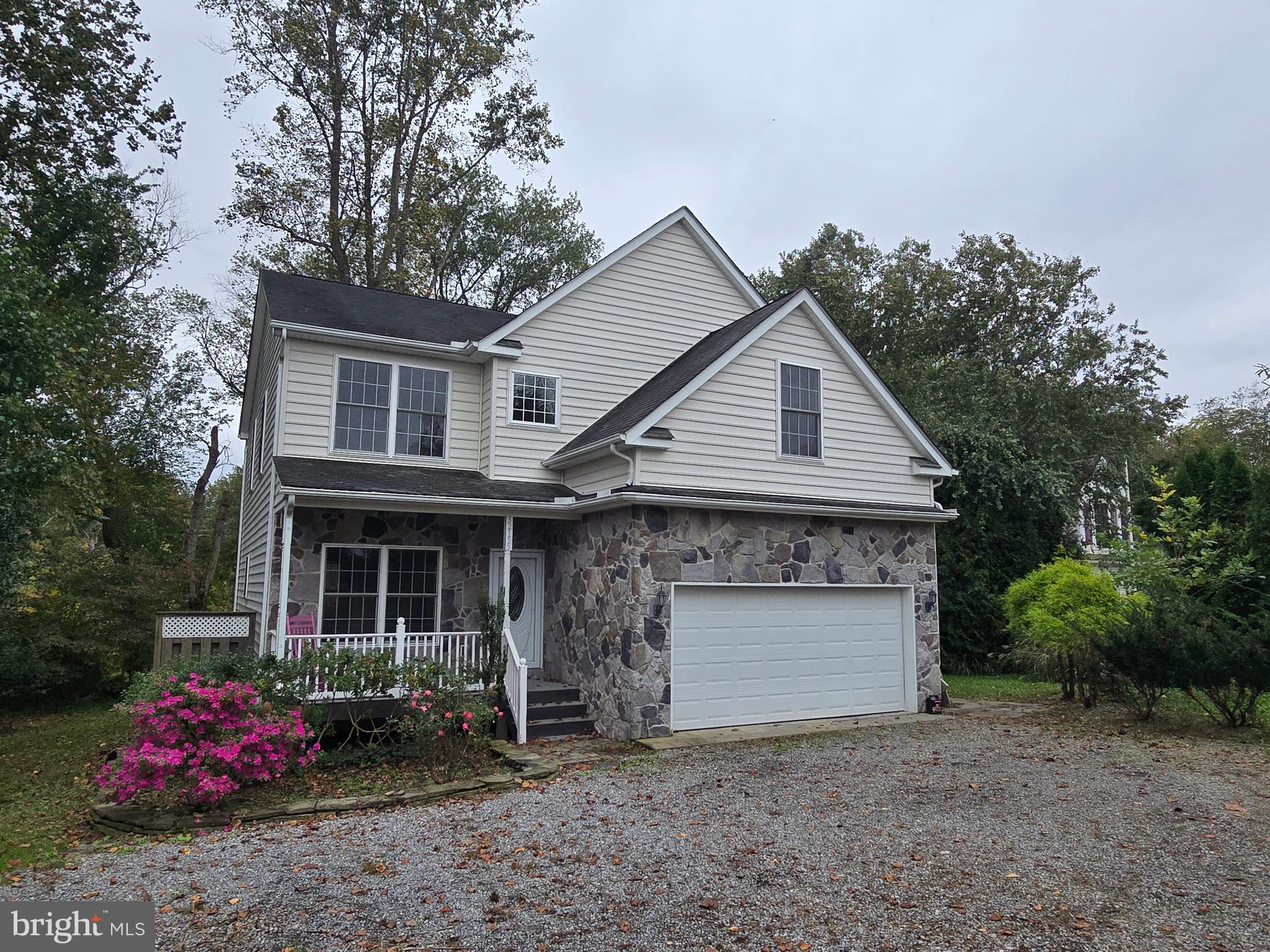 32155 River Road Millington, MD 21651 - Photo 54 of 54 a front view of a house with a garden