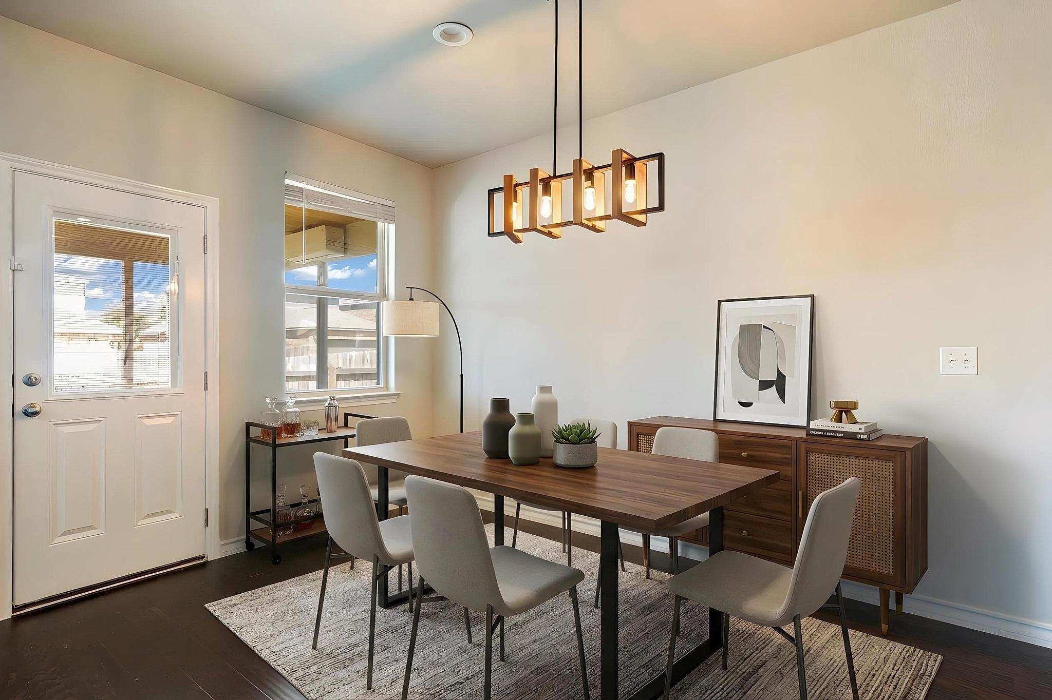 1341 Eagle Ray Street Leander, TX 78641 - Photo 9 of 37 Hardwood floors complement this inviting dining area, perfect for entertaining.