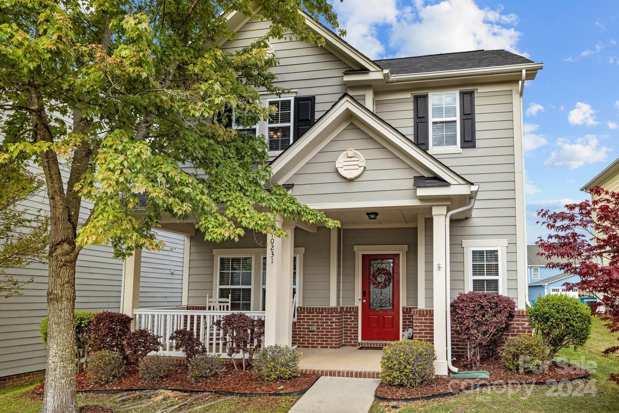 a front view of a house with garden