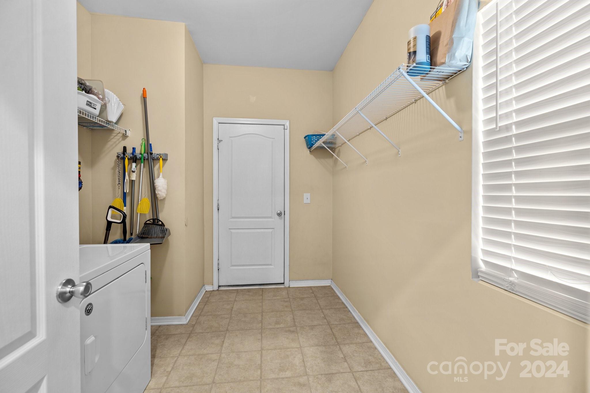 10231 Enniscrone Road Pineville, NC 28134 - Photo 20 of 44 a view of a storage & utility room with a window