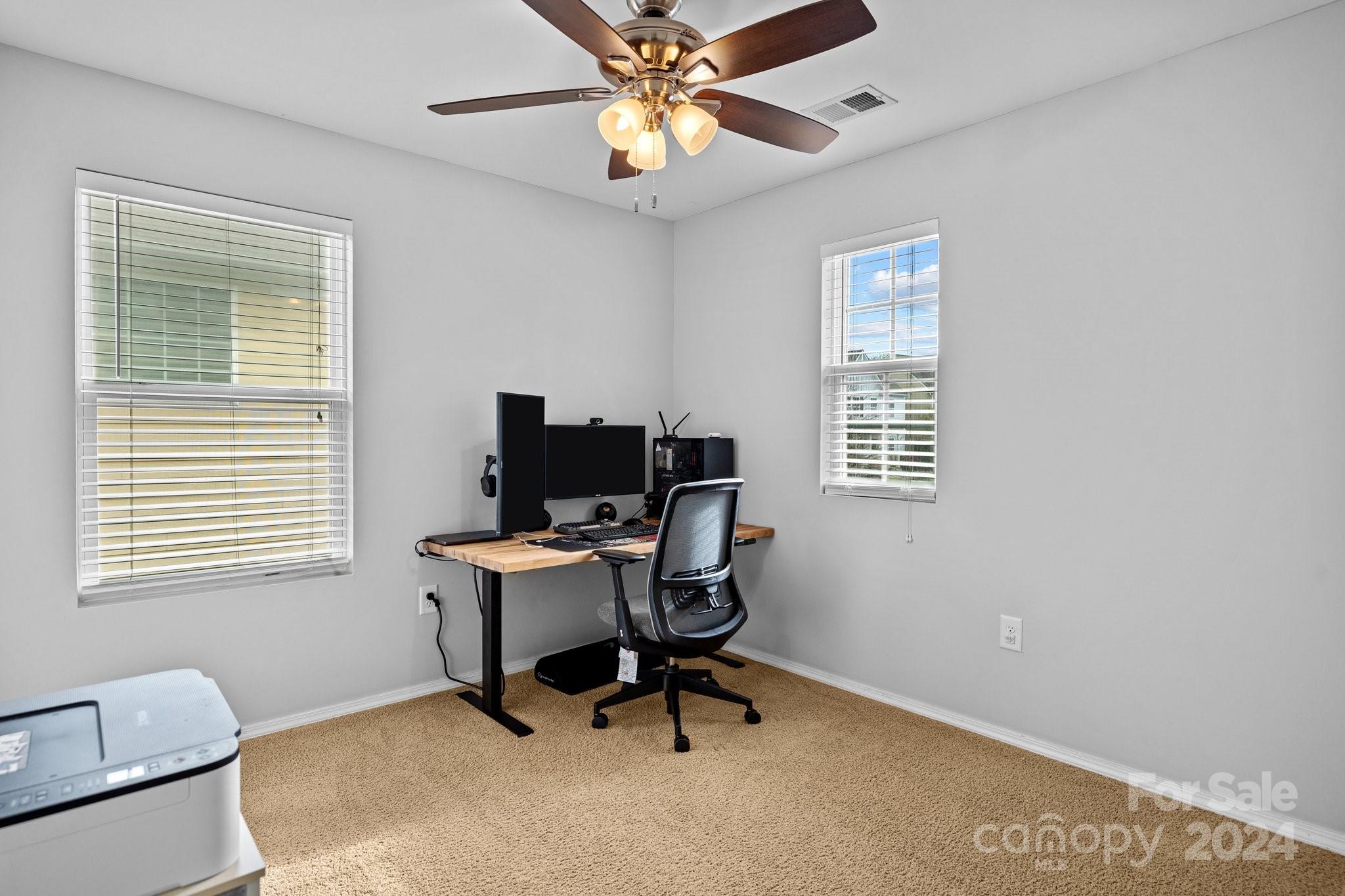 10231 Enniscrone Road Pineville, NC 28134 - Photo 21 of 44 a workspace with furniture and a window