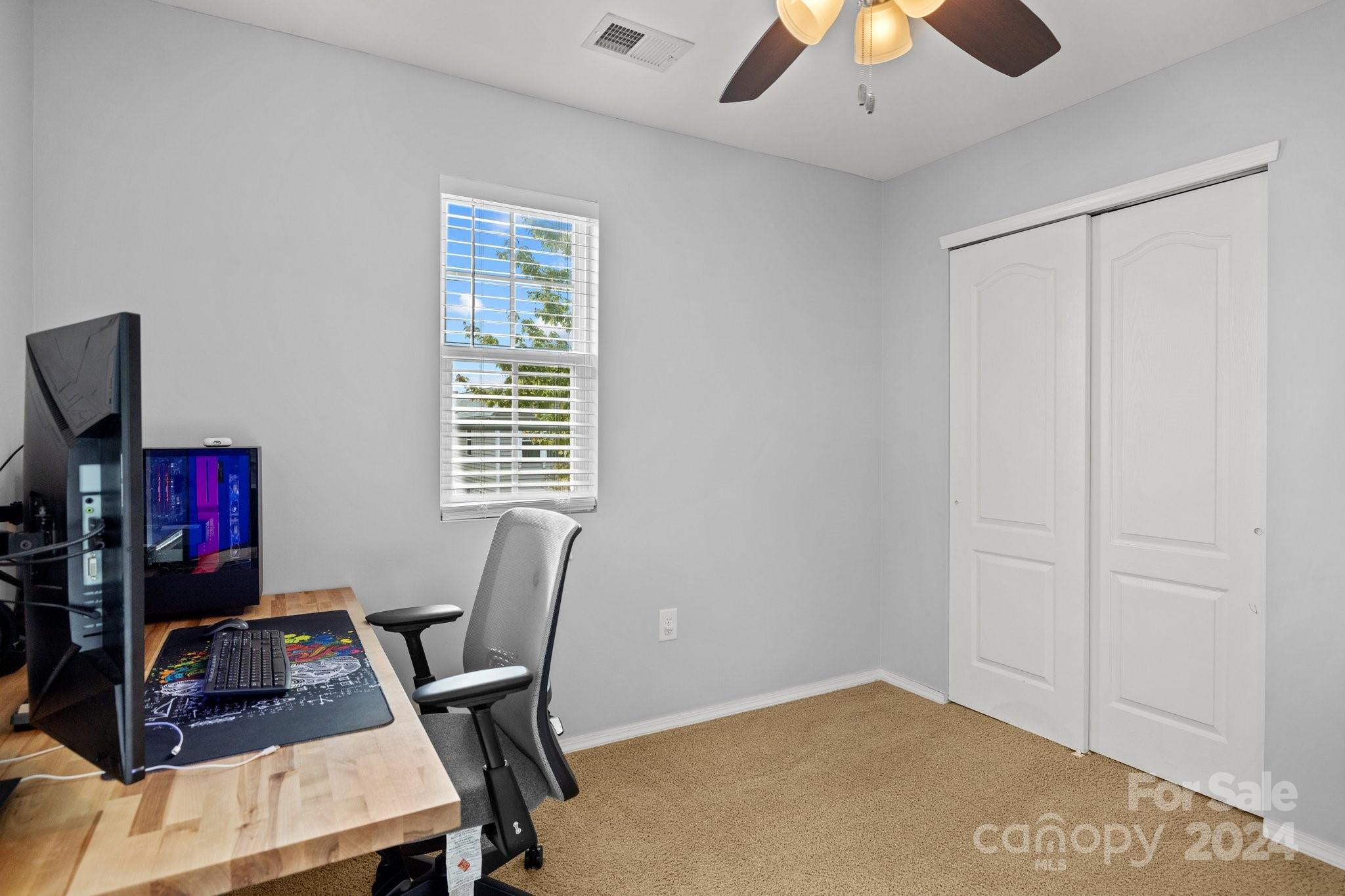 10231 Enniscrone Road Pineville, NC 28134 - Photo 22 of 44 a workspace with furniture and a window
