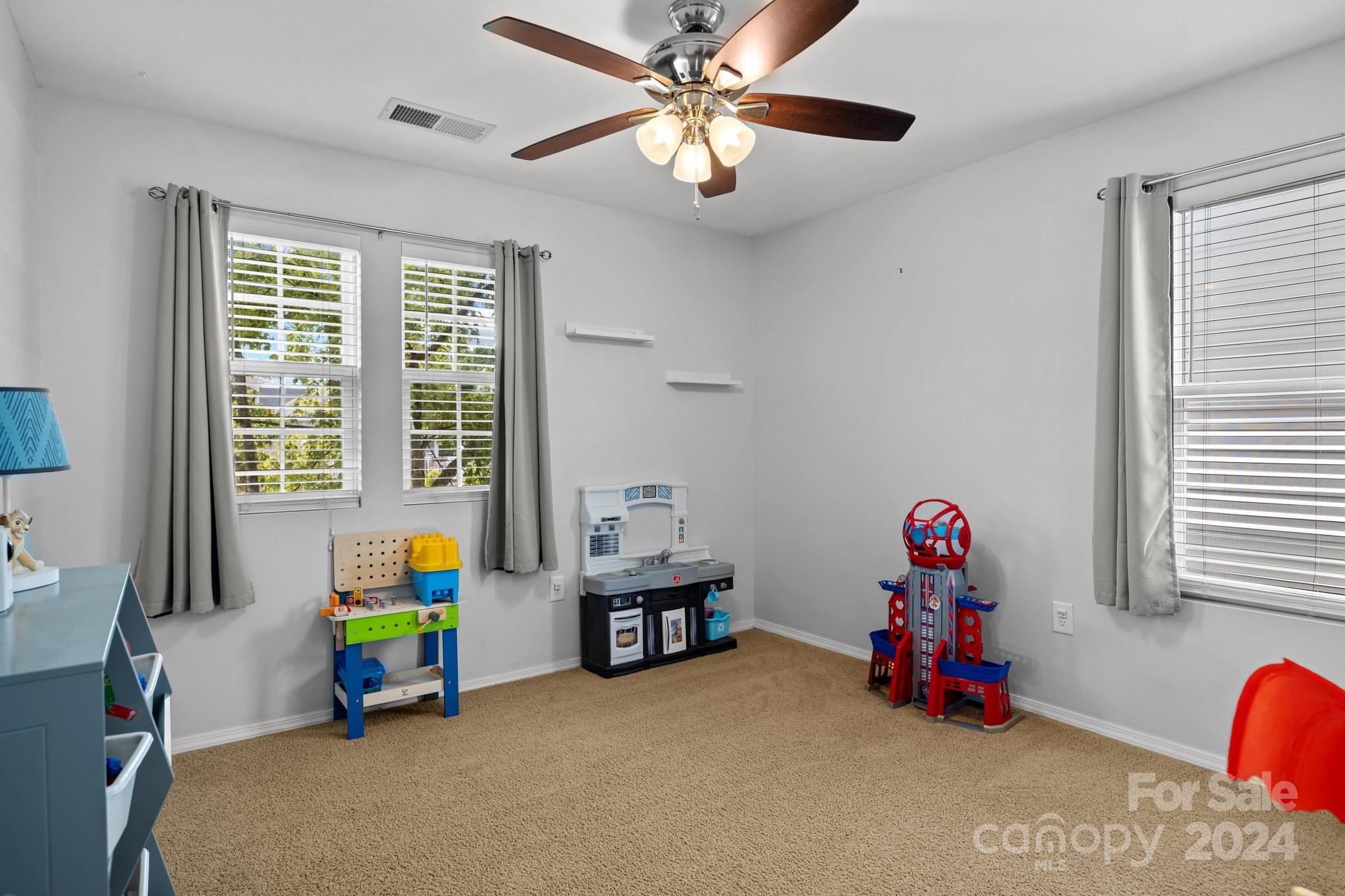 10231 Enniscrone Road Pineville, NC 28134 - Photo 23 of 44 a view of a room with toys and a window