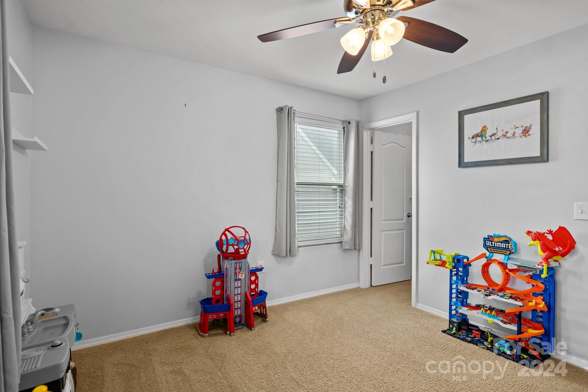 10231 Enniscrone Road Pineville, NC 28134 - Photo 24 of 44 a children room with toys and a chandelier
