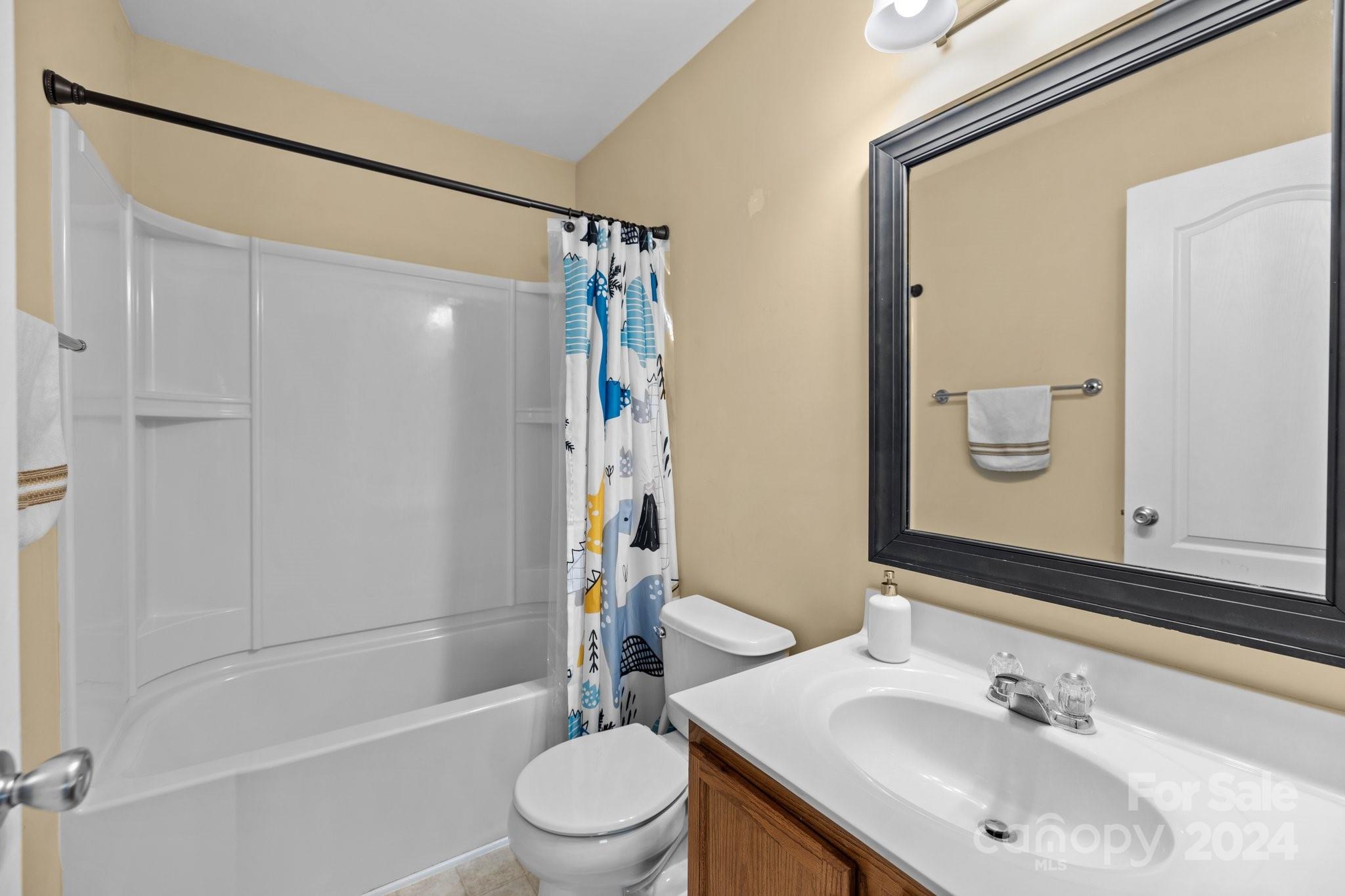 10231 Enniscrone Road Pineville, NC 28134 - Photo 26 of 44 a bathroom with a sink toilet and shower