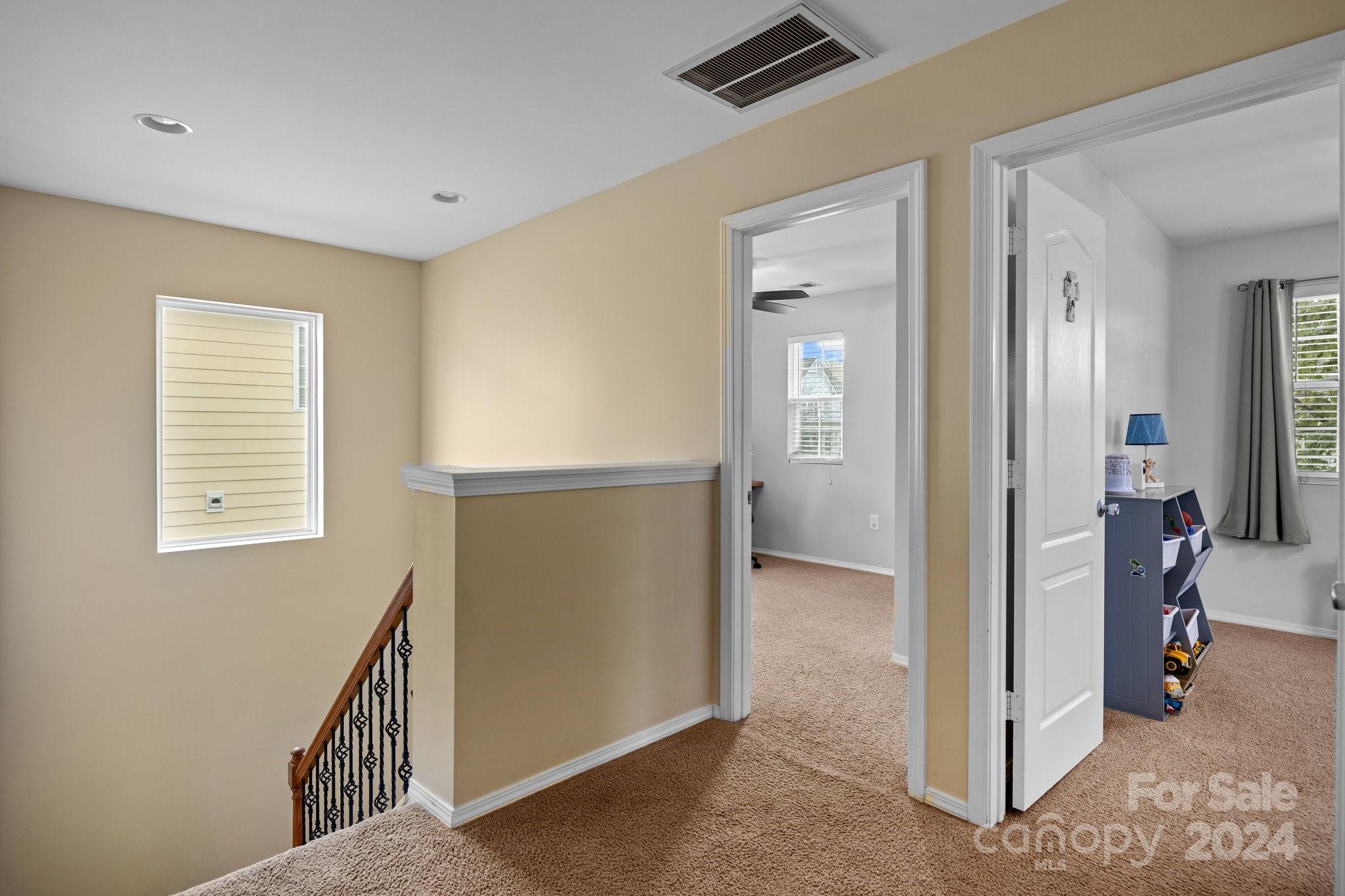 10231 Enniscrone Road Pineville, NC 28134 - Photo 35 of 44 a view of hallway with livingroom and stairs