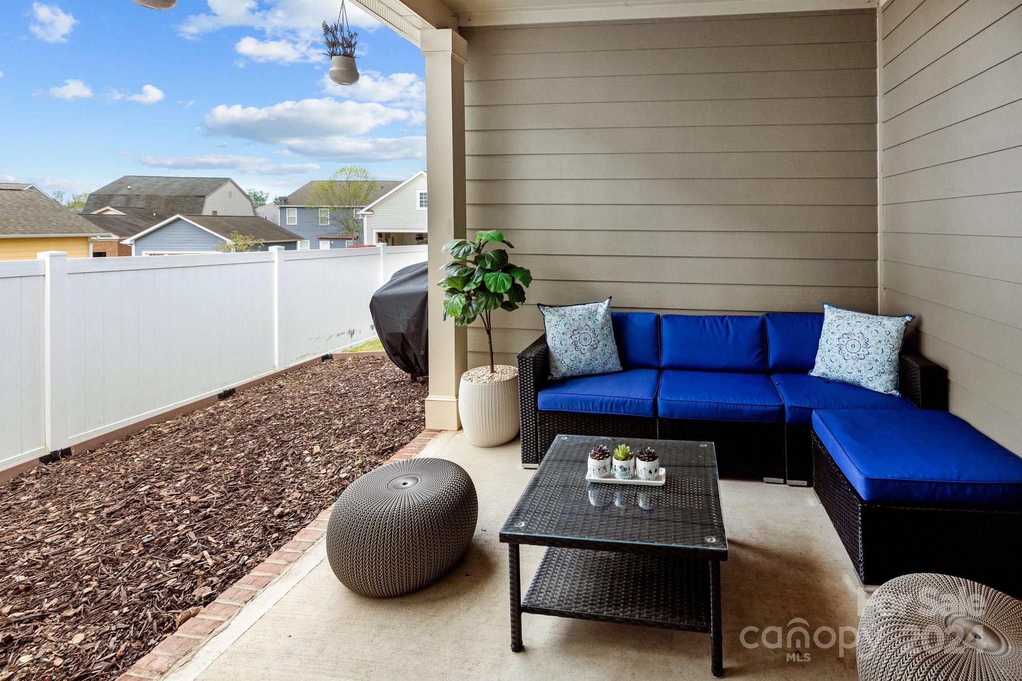 10231 Enniscrone Road Pineville, NC 28134 - Photo 36 of 44 a outdoor living space with furniture and a potted plant