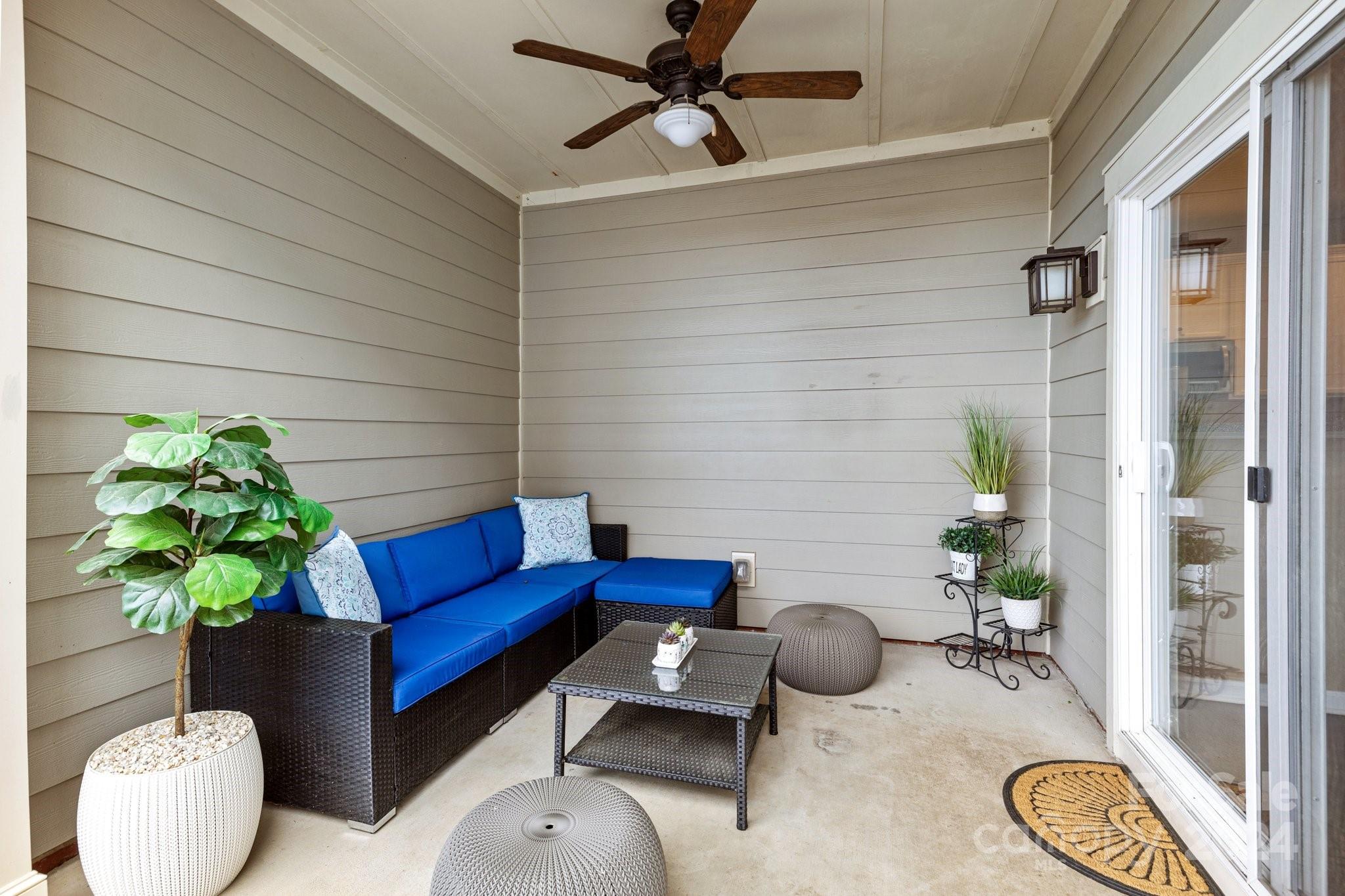 10231 Enniscrone Road Pineville, NC 28134 - Photo 37 of 44 a blue bench sitting in front of a window