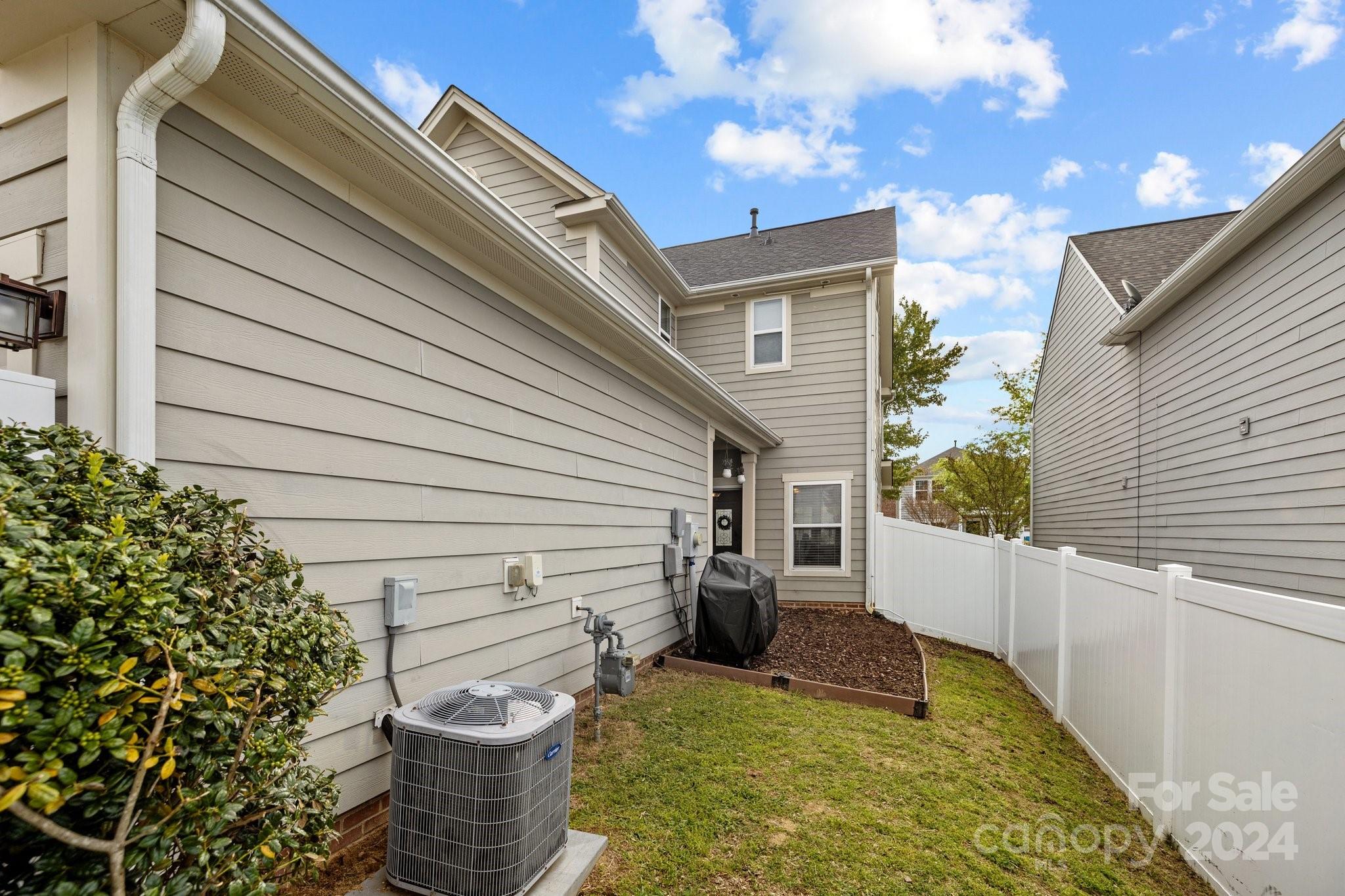 10231 Enniscrone Road Pineville, NC 28134 - Photo 40 of 44 a view of a patio with chair and tables back yard of the house
