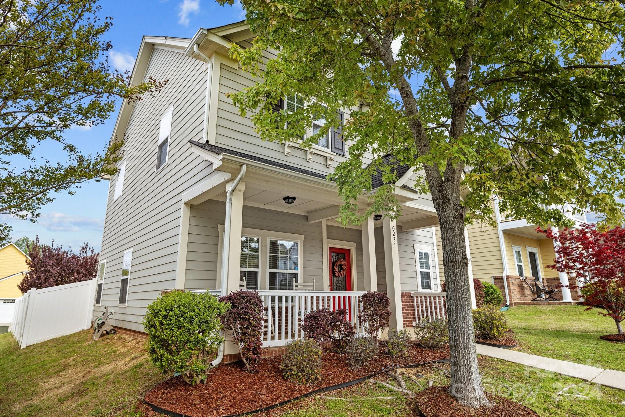 10231 Enniscrone Road Pineville, NC 28134 - Photo 4 of 44 a front view of a house with garden