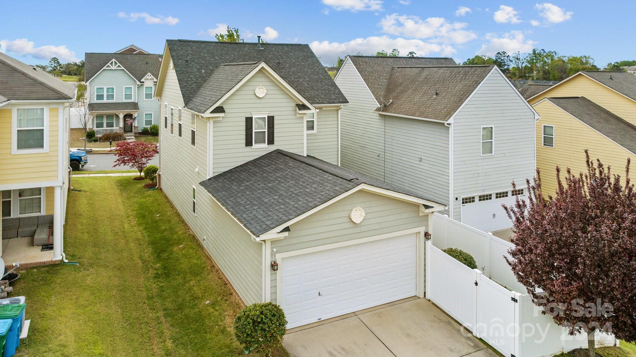 10231 Enniscrone Road Pineville, NC 28134 - Photo 41 of 44 a view of residential houses with yard and trees in the background