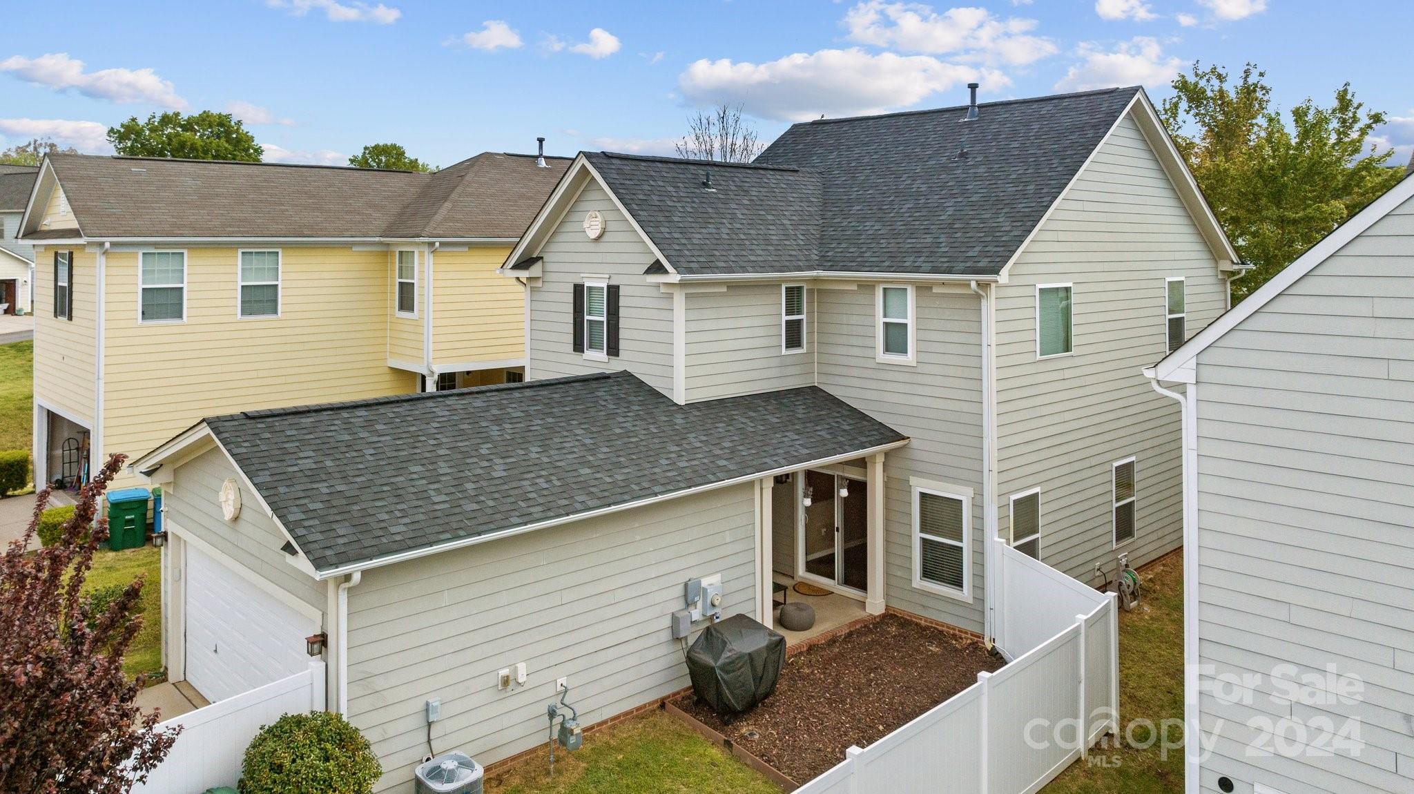 10231 Enniscrone Road Pineville, NC 28134 - Photo 42 of 44 a view of a house with roof deck