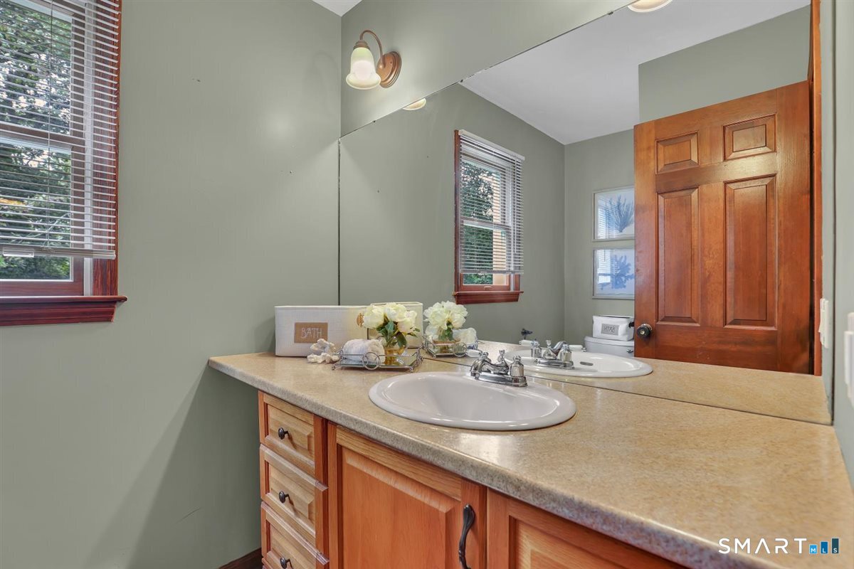 186 Alps Road Branford, CT 06405 - Photo 13 of 35 Conveniently located on the main level, the powder room with tile floor offers easy access for family and guests.