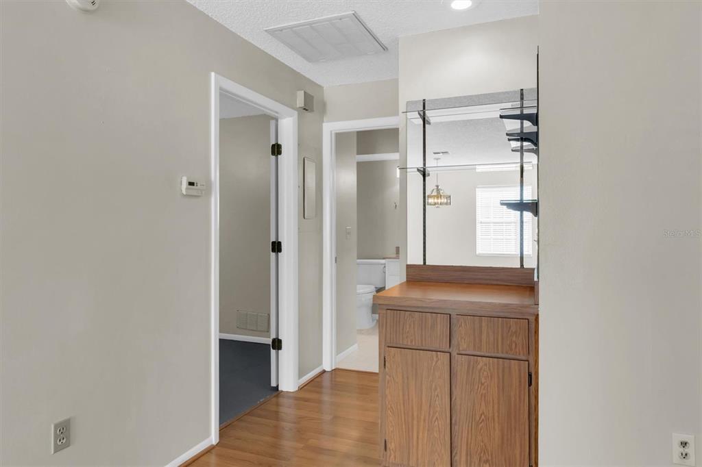 4814 Grist Mill Circle New Port Richey, FL 34655 - Photo 18 of 63 a room with a refrigerator and a sink