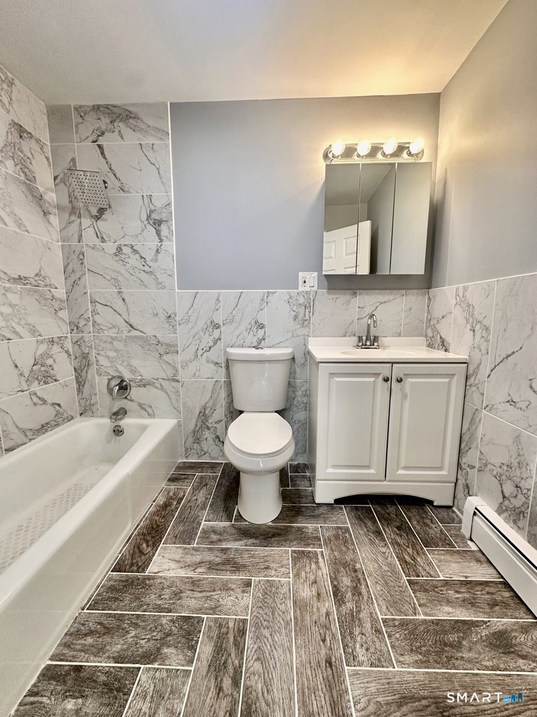 46 Warren Street New Haven, CT 06511 - Photo 10 of 10 a bathroom with a toilet sink and mirror