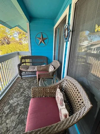 a spacious bedroom with a bed and a couch