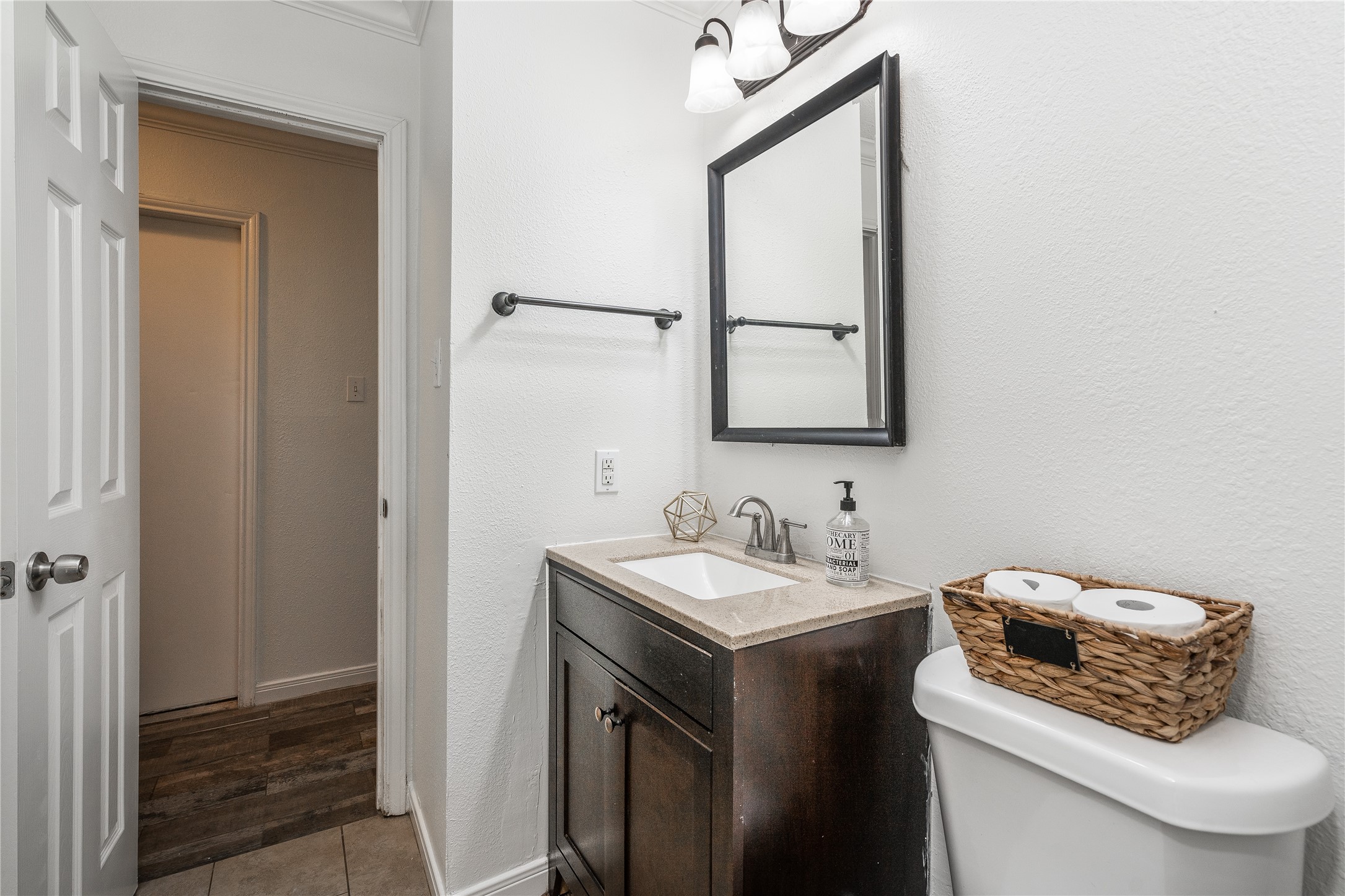 718 Regency Court Friendswood, TX 77546 - Photo 14 of 21 Half bathroom located on the first floor is perfect for guests.