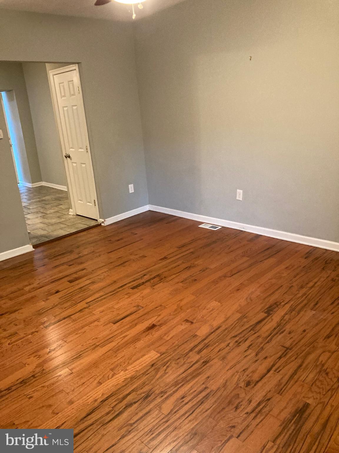 1213 West Old Cold Spring Lane Baltimore, MD 21211 - Photo 8 of 15 a view of empty room with wooden floor