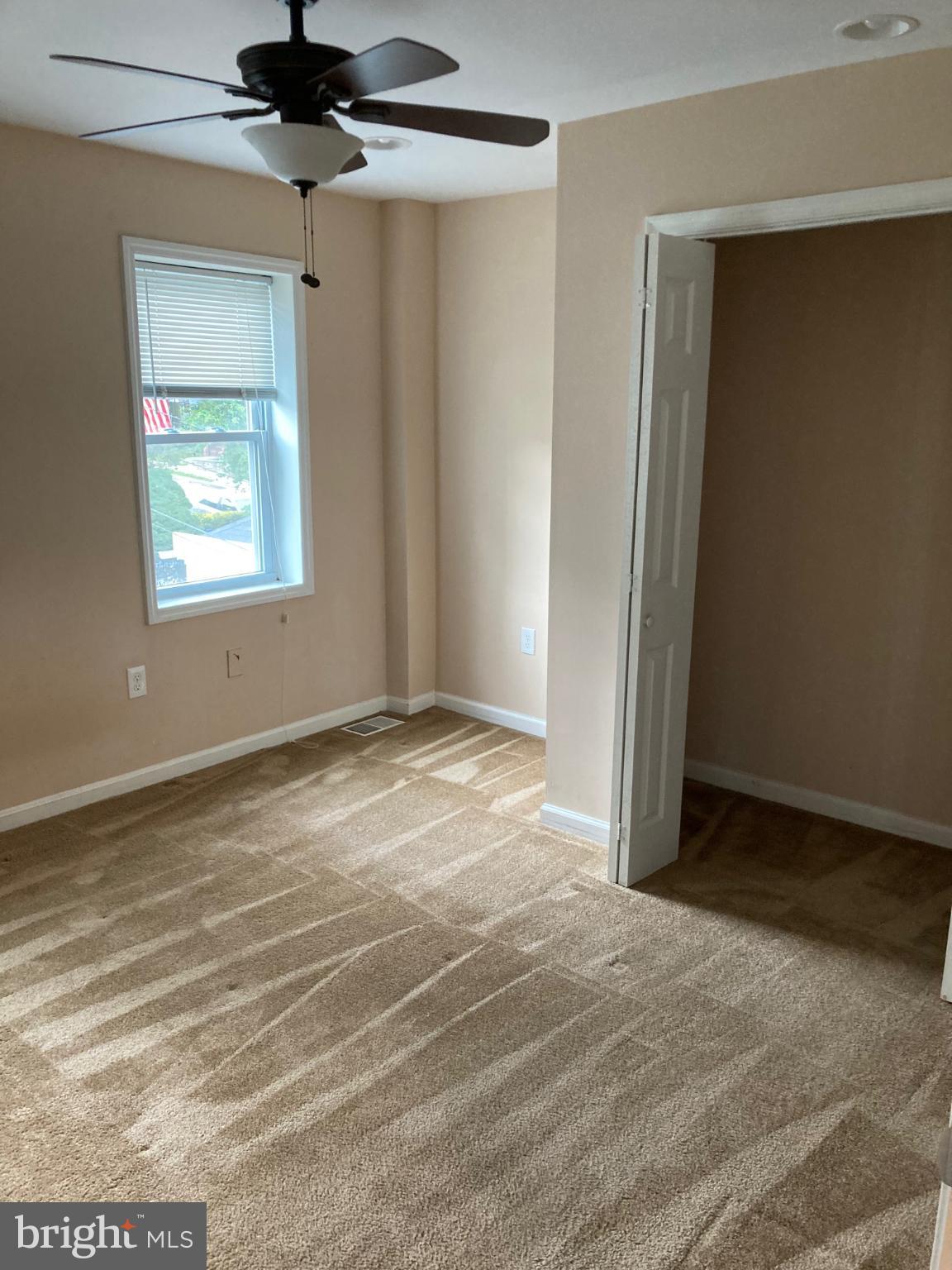 1213 West Old Cold Spring Lane Baltimore, MD 21211 - Photo 10 of 15 a view of an empty room with a window