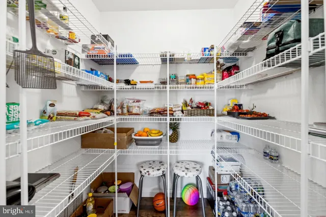 a utility room with stainless steel appliances and cabinets