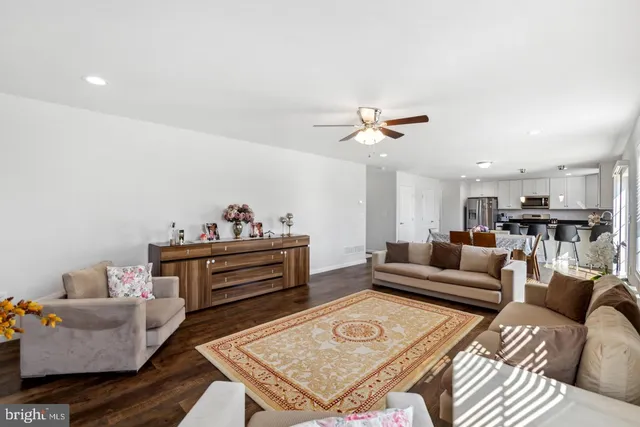 a living room with furniture and a table