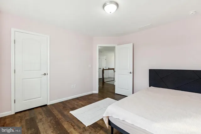 a bedroom with a bed and a table in it