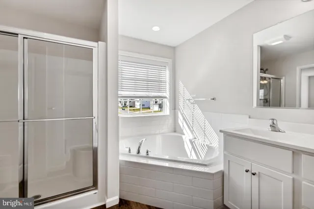 a bathroom with a bathtub and a sink