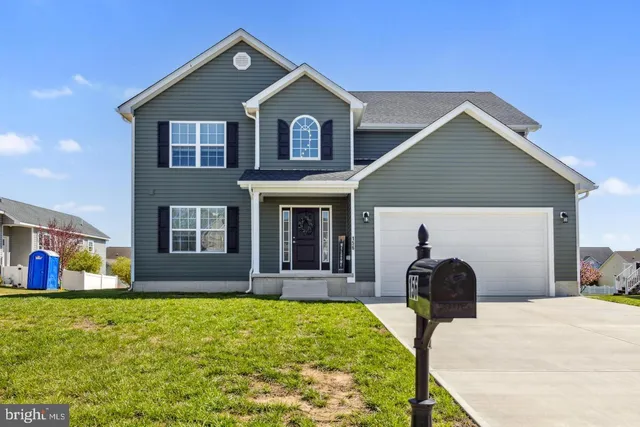 a front view of house with yard and seating area