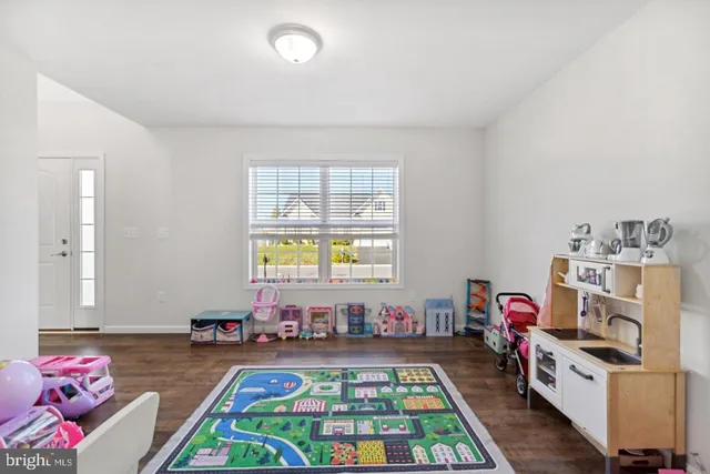 a bedroom with furniture and a baby crib