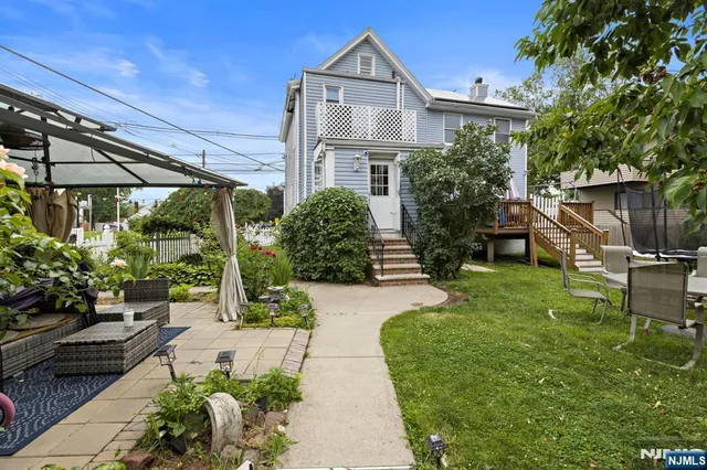 a view of two chairs in the patio