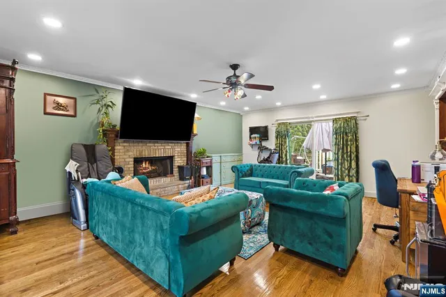 a living room with fireplace furniture and a flat screen tv