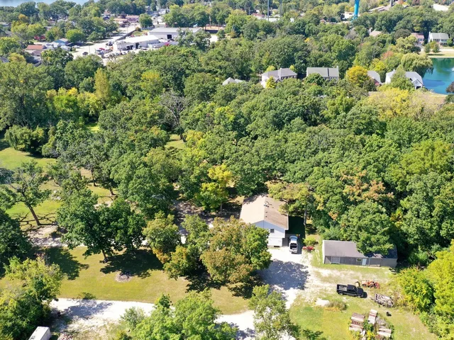 a view of a house with a yard and garden