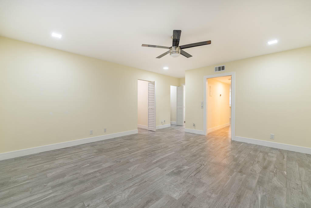 14250 Nesting Way, Unit B Delray Beach, FL 33484 - Photo 25 of 45 wooden floor in an empty room