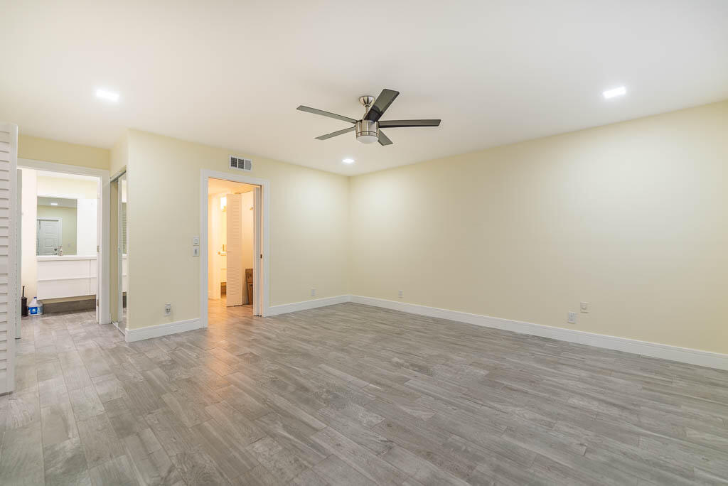 14250 Nesting Way, Unit B Delray Beach, FL 33484 - Photo 26 of 45 an empty room with fan and windows