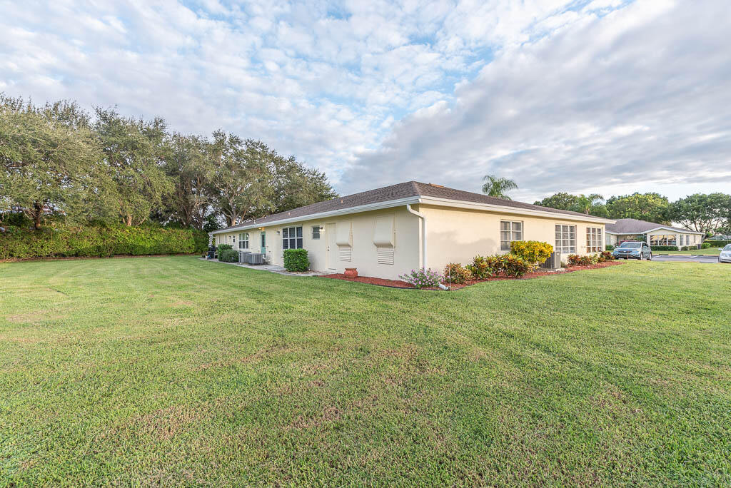 14250 Nesting Way, Unit B Delray Beach, FL 33484 - Photo 30 of 45 a view of a house with backyard and garden