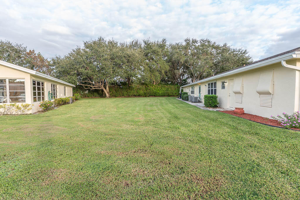 14250 Nesting Way, Unit B Delray Beach, FL 33484 - Photo 31 of 45 a view of a house with a yard