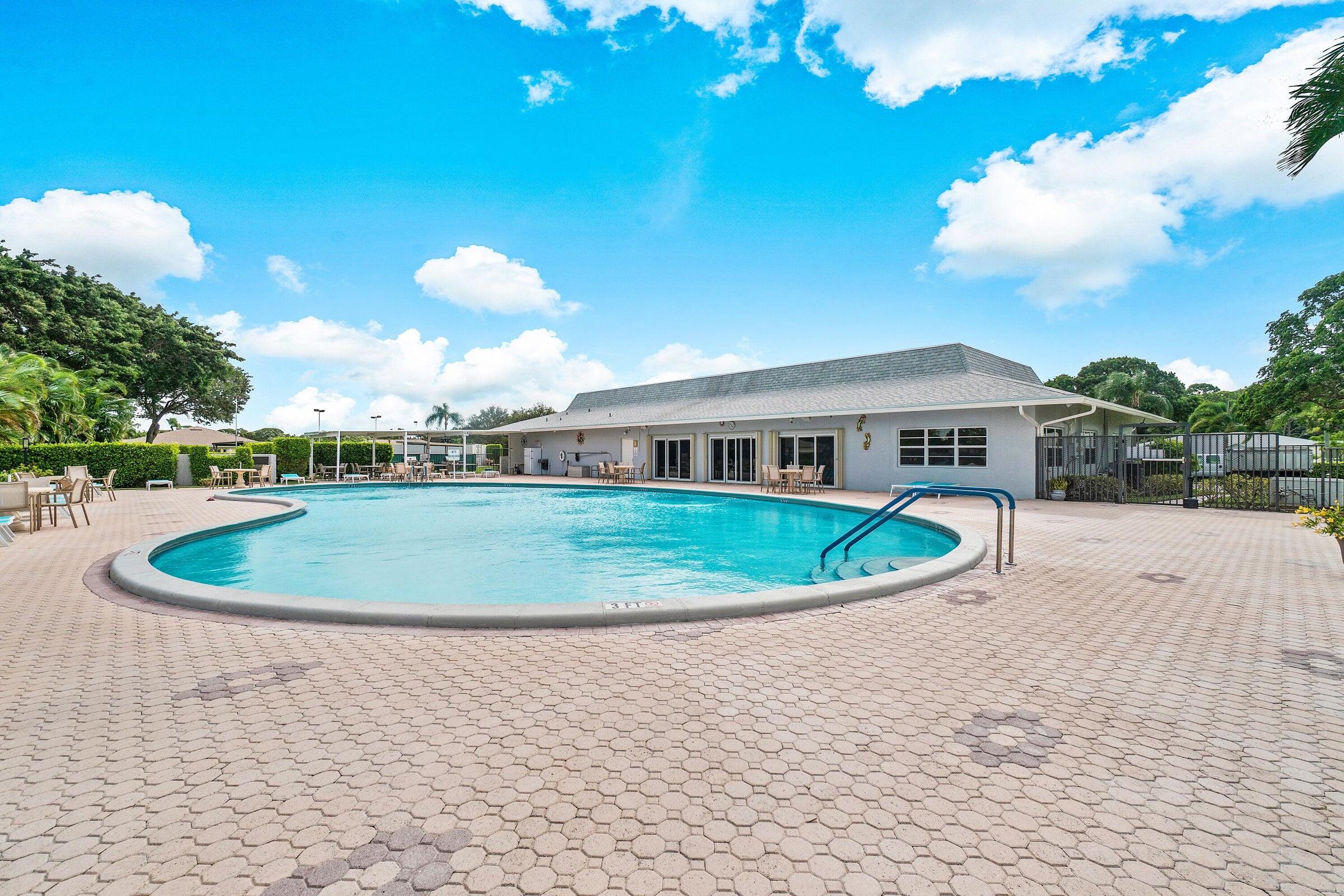 14250 Nesting Way, Unit B Delray Beach, FL 33484 - Photo 36 of 45 a view of outdoor space yard and swimming pool