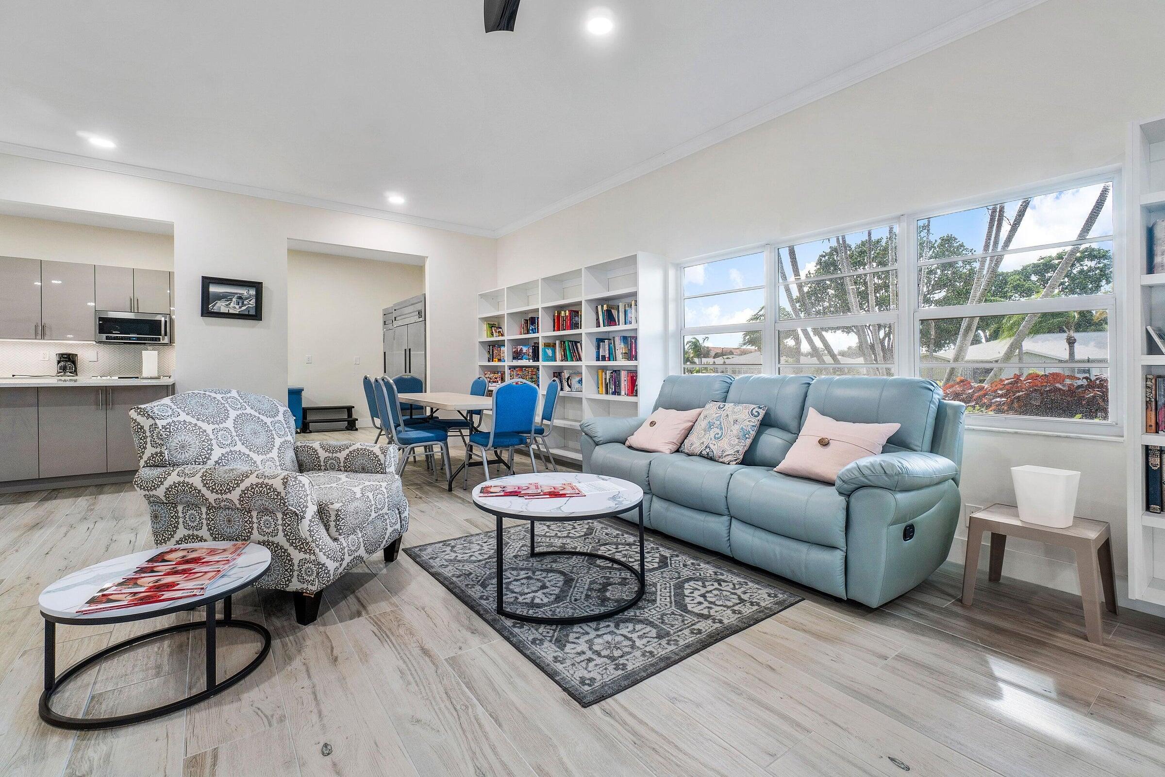 14250 Nesting Way, Unit B Delray Beach, FL 33484 - Photo 38 of 45 a living room with furniture and a large window