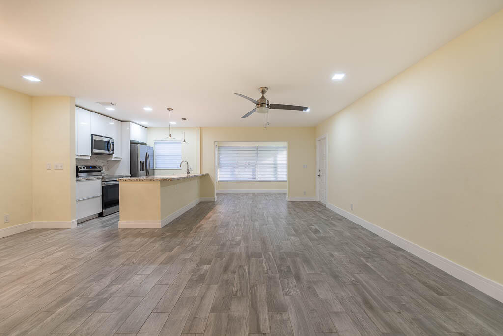 14250 Nesting Way, Unit B Delray Beach, FL 33484 - Photo 7 of 45 a view of kitchen with wooden floor