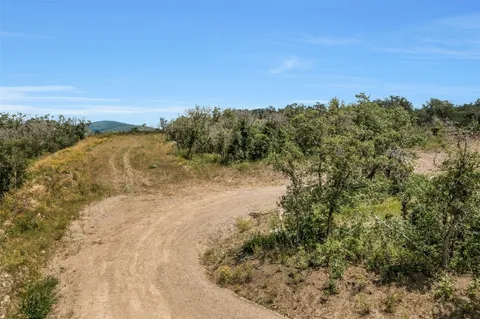 a view of a yard with a mountain