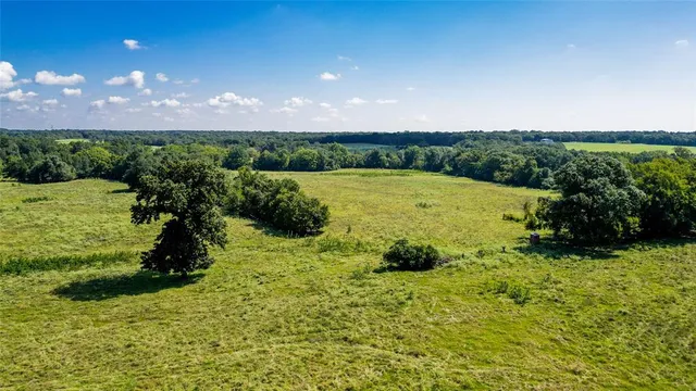 a view of lake with green space
