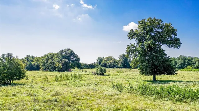 a view of lake with green space