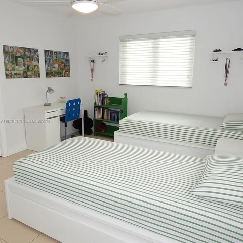 a bedroom with a bed and a table