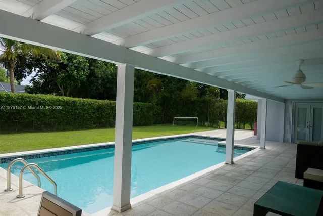 a view of swimming pool and garden
