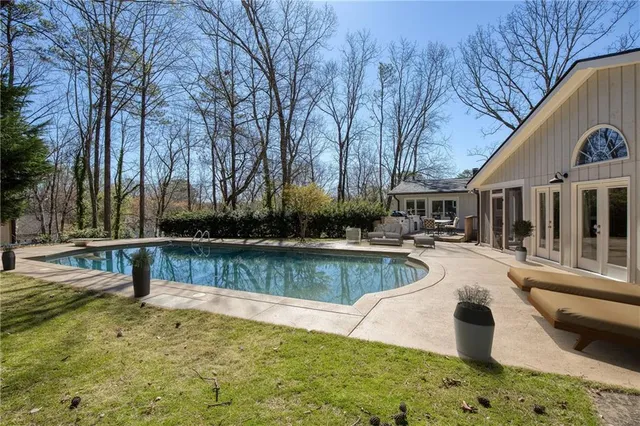 a view of a swimming pool with a patio